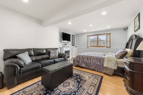 Bedroom, Fireplace, Interior, Living room, Recessed Lighting, Wood Texture Flooring
