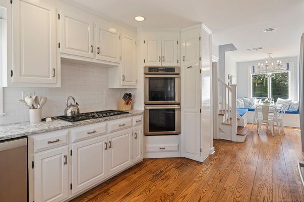 Chandelier, Dining room, Interior, Kitchen, Recessed Lighting, Stainless Steel Appliances, Wood Texture Flooring