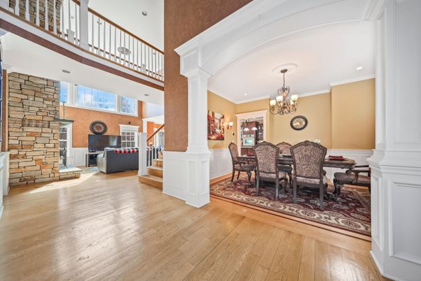 Chandelier, Dining room, Fireplace, Interior, Recessed Lighting, Stone Walls, Wood Texture Flooring