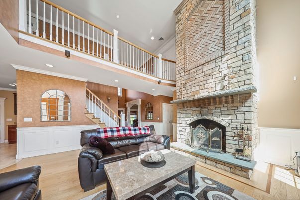 Fireplace, Interior, Living room, Recessed Lighting, Stone Walls, Wood Texture Flooring