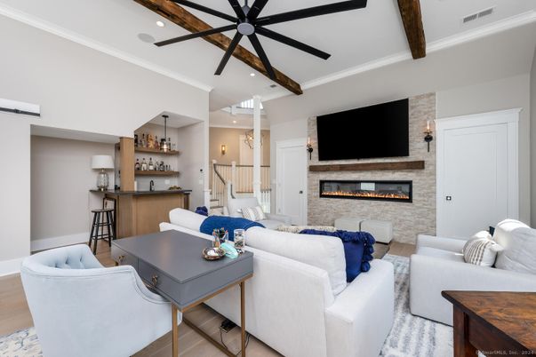 Fireplace, Interior, Living room, Recessed Lighting, Stone Walls, Wooden Beams, Wood Texture Flooring