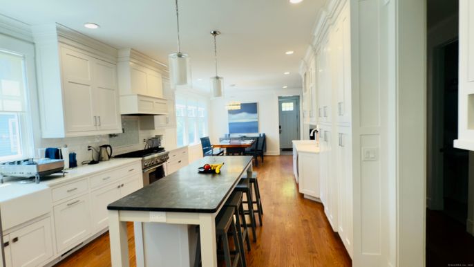 Dining room, Interior, Kitchen, Pendant Lights, Recessed Lighting, Stainless Steel Appliances, Wood Texture Flooring