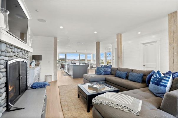 Fireplace, Interior, Living room, Recessed Lighting, Stone Walls, Wood Texture Flooring
