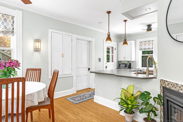 Dining room, Fireplace, Interior, Kitchen, Pendant Lights, Recessed Lighting, Wood Texture Flooring