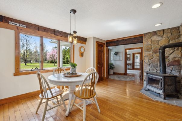 Dining room, Fireplace, Interior, Pendant Lights, Recessed Lighting, Stone Walls, Wood Texture Flooring