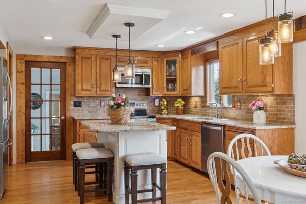Dining room, Interior, Kitchen, Pendant Lights, Recessed Lighting, Stainless Steel Appliances, Wood Texture Flooring