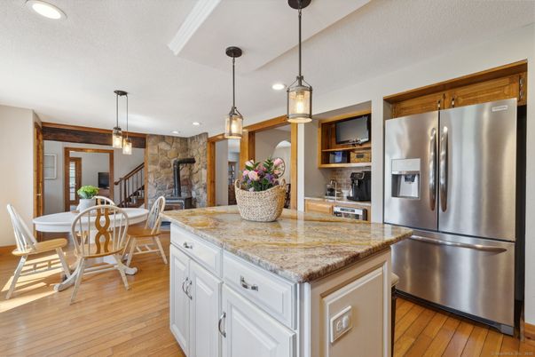 Dining room, Interior, Kitchen, Pendant Lights, Recessed Lighting, Stainless Steel Appliances, Stone Walls, Wood Texture Flooring