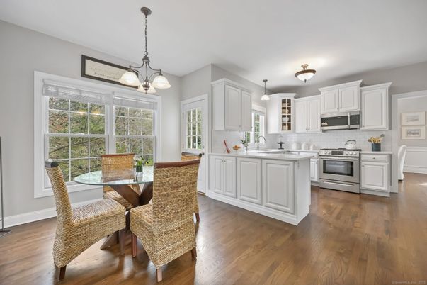 Dining room, Interior, Kitchen, Pendant Lights, Stainless Steel Appliances, Wood Texture Flooring