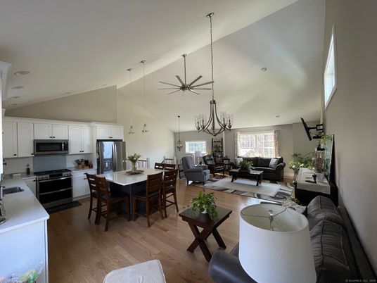 Chandelier, Dining room, Interior, Kitchen, Living room, Pendant Lights, Stainless Steel Appliances, Wood Texture Flooring