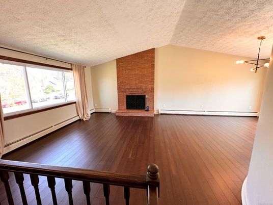 Empty room, Fireplace, Interior, Pendant Lights, Stone Walls, Wood Texture Flooring