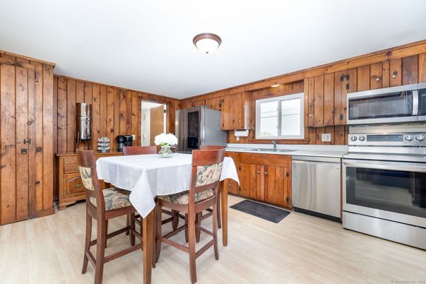 Dining room, Interior, Kitchen, Stainless Steel Appliances, Wood Texture Flooring, Wooden Walls