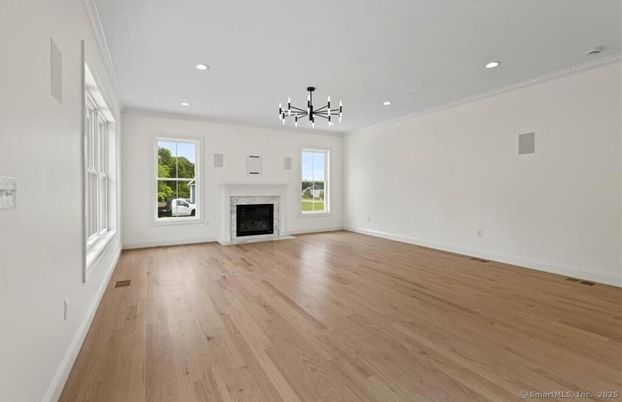 Empty room, Fireplace, Interior, Pendant Lights, Recessed Lighting, Wood Texture Flooring