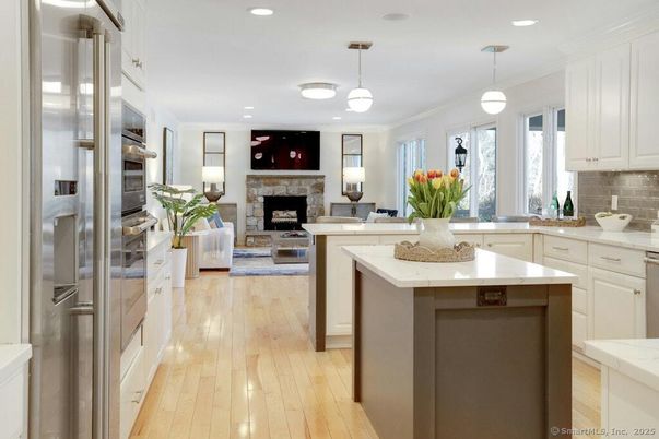 Fireplace, Interior, Kitchen, Living room, Pendant Lights, Recessed Lighting, Stainless Steel Appliances, Wood Texture Flooring