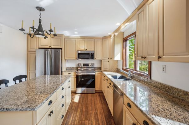 Chandelier, Interior, Kitchen, Recessed Lighting, Stainless Steel Appliances, Wood Texture Flooring