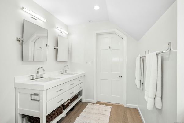 Bathroom, Dual Sink Vanities, Interior, Recessed Lighting, Wood Texture Flooring