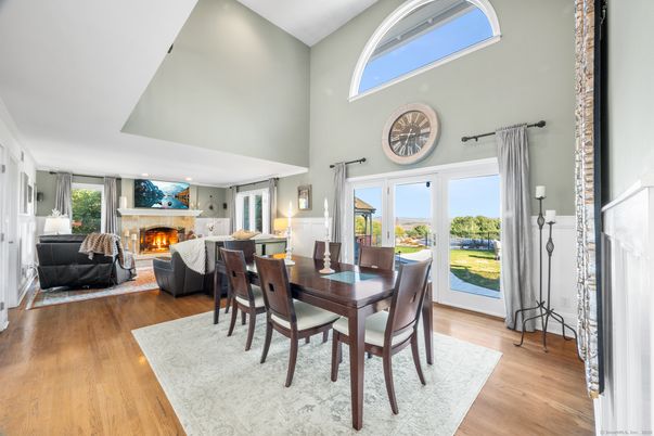 Dining room, Fireplace, Interior, Living room, Recessed Lighting, Wood Texture Flooring