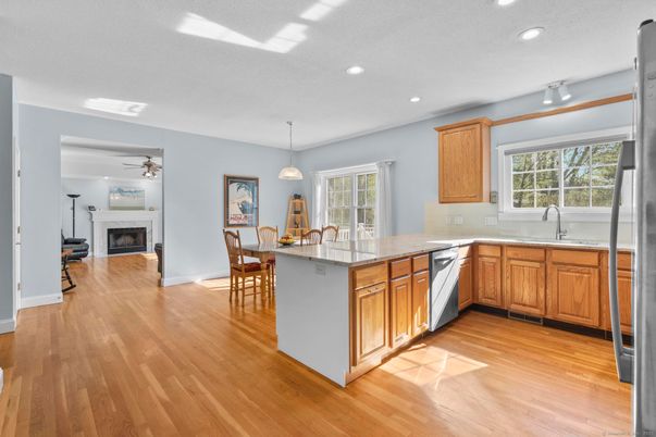 Dining room, Fireplace, Interior, Kitchen, Pendant Lights, Recessed Lighting, Wood Texture Flooring