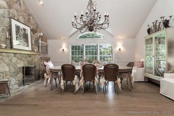 Chandelier, Dining room, Fireplace, Interior, Stone Walls, Wood Texture Flooring