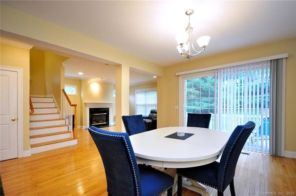 Chandelier, Dining room, Fireplace, Interior, Recessed Lighting, Wood Texture Flooring