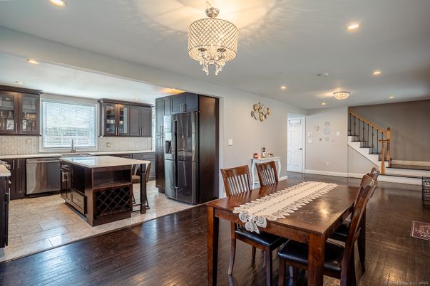 Chandelier, Dining room, Interior, Kitchen, Recessed Lighting, Stainless Steel Appliances, Wood Texture Flooring