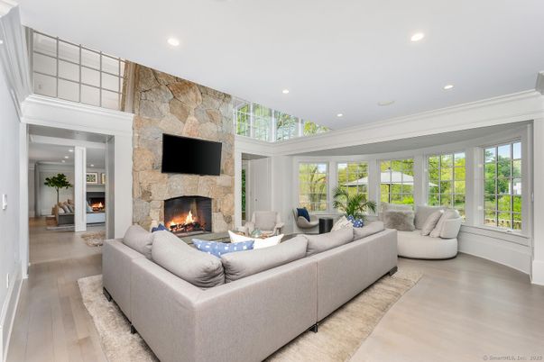 Fireplace, Interior, Living room, Recessed Lighting, Stone Walls, Wood Texture Flooring