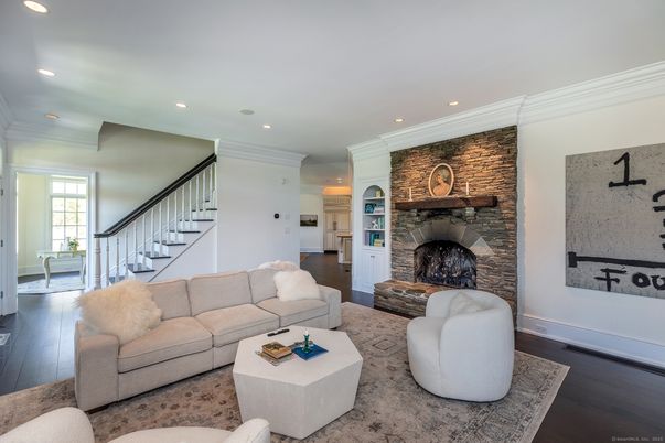 Fireplace, Interior, Living room, Recessed Lighting, Stone Walls, Wood Texture Flooring