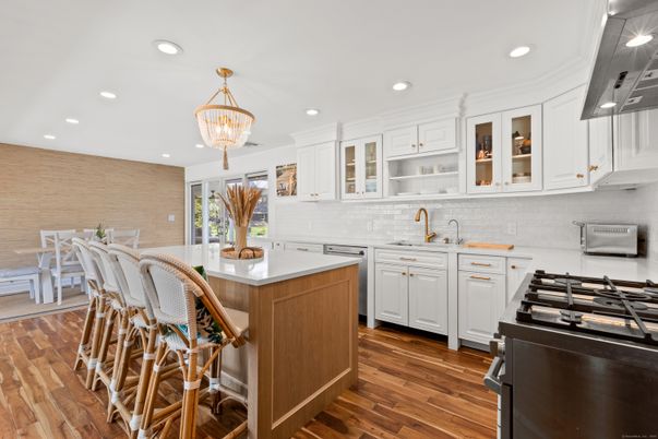 Chandelier, Dining room, Interior, Kitchen, Recessed Lighting, Stainless Steel Appliances, Wood Texture Flooring