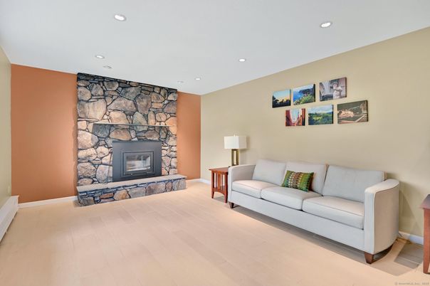 Fireplace, Interior, Living room, Recessed Lighting, Stone Walls, Wood Texture Flooring