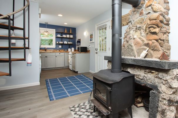 Fireplace, Interior, Kitchen, Pendant Lights, Recessed Lighting, Stone Walls, Wood Texture Flooring
