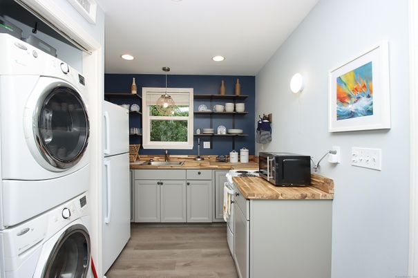 Interior, Kitchen, Recessed Lighting, Washer, Wood Texture Flooring