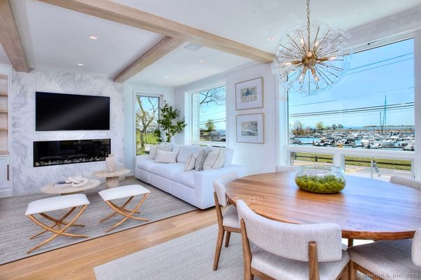 Chandelier, Dining room, Fireplace, Interior, Living room, Pendant Lights, Recessed Lighting, Wooden Beams, Wood Texture Flooring