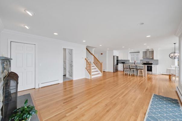 Dining room, Fireplace, Interior, Kitchen, Pendant Lights, Recessed Lighting, Stainless Steel Appliances, Wood Texture Flooring