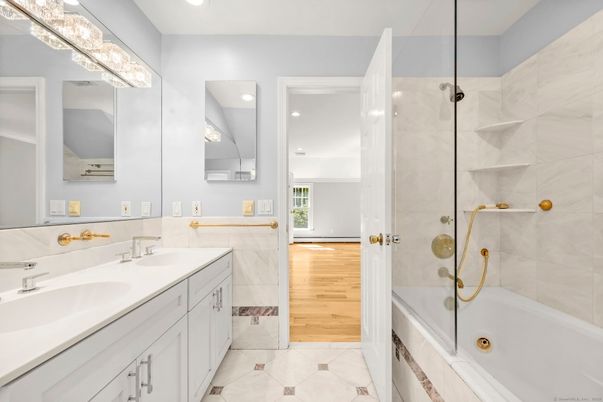 Bathroom, Dual Sink Vanities, Glass Shower, Interior, Recessed Lighting, Wood Texture Flooring