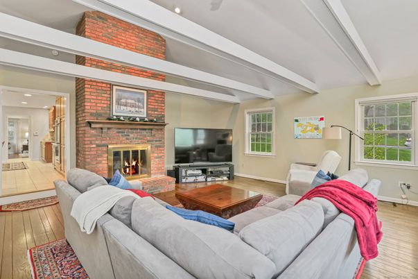 Fireplace, Interior, Living room, Recessed Lighting, Stone Walls, Wood Texture Flooring