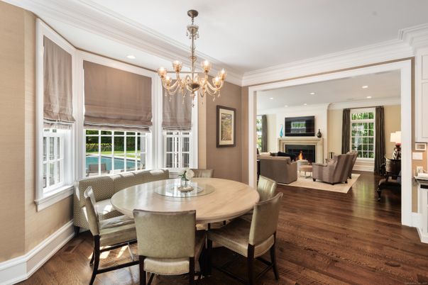 Chandelier, Dining room, Fireplace, Interior, Living room, Recessed Lighting, Wood Texture Flooring