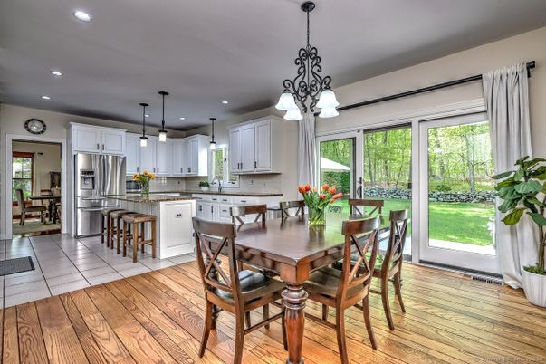 Dining room, Interior, Kitchen, Pendant Lights, Recessed Lighting, Stainless Steel Appliances, Wood Texture Flooring