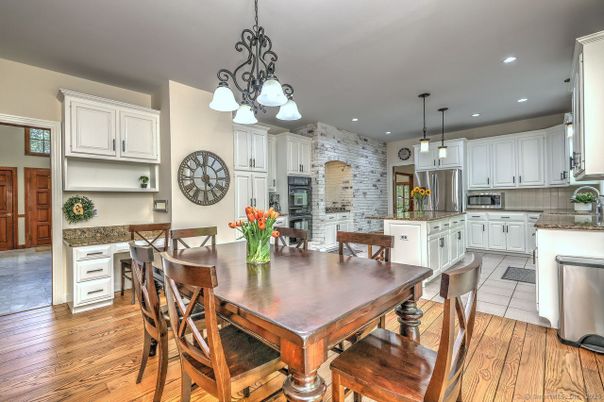 Dining room, Interior, Kitchen, Pendant Lights, Recessed Lighting, Stainless Steel Appliances, Stone Walls, Wood Texture Flooring