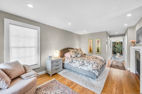 Bedroom, Fireplace, Interior, Recessed Lighting, Wood Texture Flooring