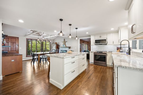 Dining room, Interior, Kitchen, Pendant Lights, Recessed Lighting, Stainless Steel Appliances, Wood Texture Flooring