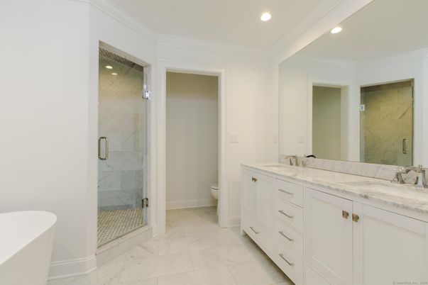 Bathroom, Dual Sink Vanities, Free Standing Baths, Glass Shower, Interior, Marble, Marble Walls, Recessed Lighting