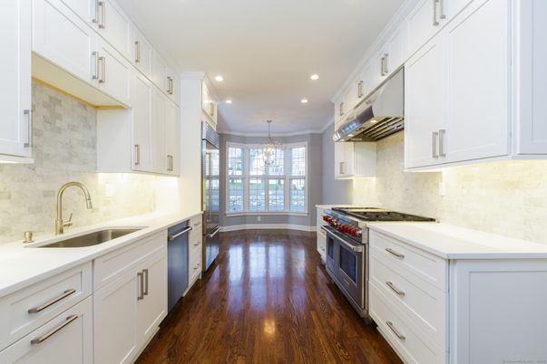 Chandelier, Interior, Kitchen, Recessed Lighting, Stainless Steel Appliances, Wood Texture Flooring