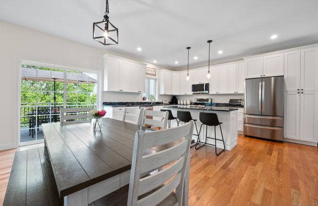 Dining room, Interior, Kitchen, Pendant Lights, Recessed Lighting, Stainless Steel Appliances, Wood Texture Flooring