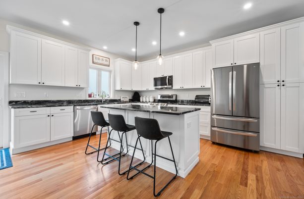 Interior, Kitchen, Pendant Lights, Recessed Lighting, Stainless Steel Appliances, Wood Texture Flooring