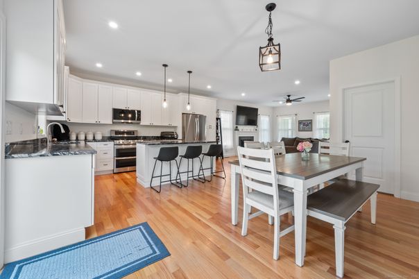 Dining room, Interior, Kitchen, Pendant Lights, Recessed Lighting, Stainless Steel Appliances, Wood Texture Flooring