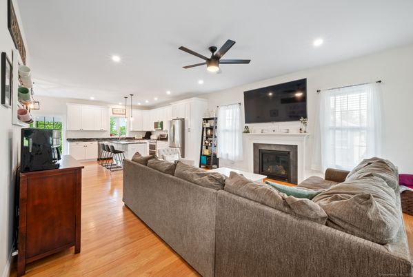 Fireplace, Interior, Kitchen, Living room, Recessed Lighting, Stainless Steel Appliances, Wood Texture Flooring