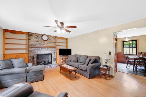 Dining room, Fireplace, Interior, Living room, Pendant Lights, Stone Walls, Wood Texture Flooring