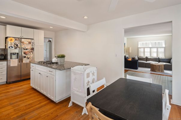 Dining room, Interior, Kitchen, Living room, Recessed Lighting, Stainless Steel Appliances, Wood Texture Flooring