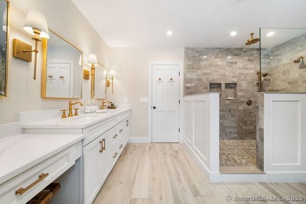 Bathroom, Dual Sink Vanities, Glass Shower, Interior, Recessed Lighting, Stone Walls, Wood Texture Flooring