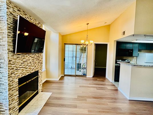 Chandelier, Fireplace, Interior, Kitchen, Pendant Lights, Stone Walls, Wood Texture Flooring