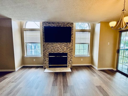 Empty room, Fireplace, Interior, Pendant Lights, Stone Walls, Wood Texture Flooring